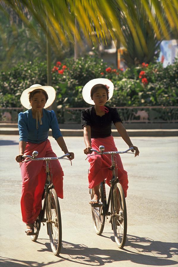 Dai Girl Cyclists in Xishuangbanna, China
