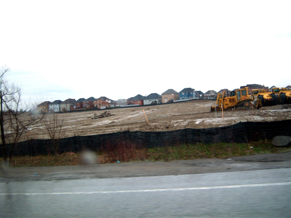 These houses in a new subdivision are creeping closer and closer by bruni