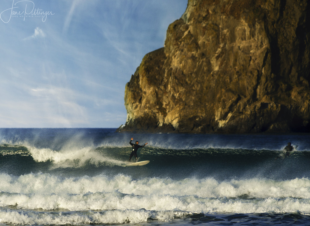 Surfing By Haystack Rock by jgpittenger