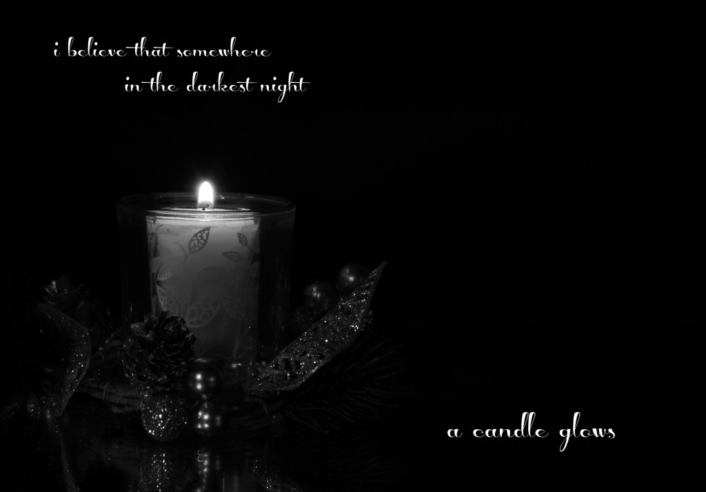 a candle glows by summerfield