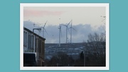 8th Dec 2017 - Wind turbines and snow on the hills and roofs.