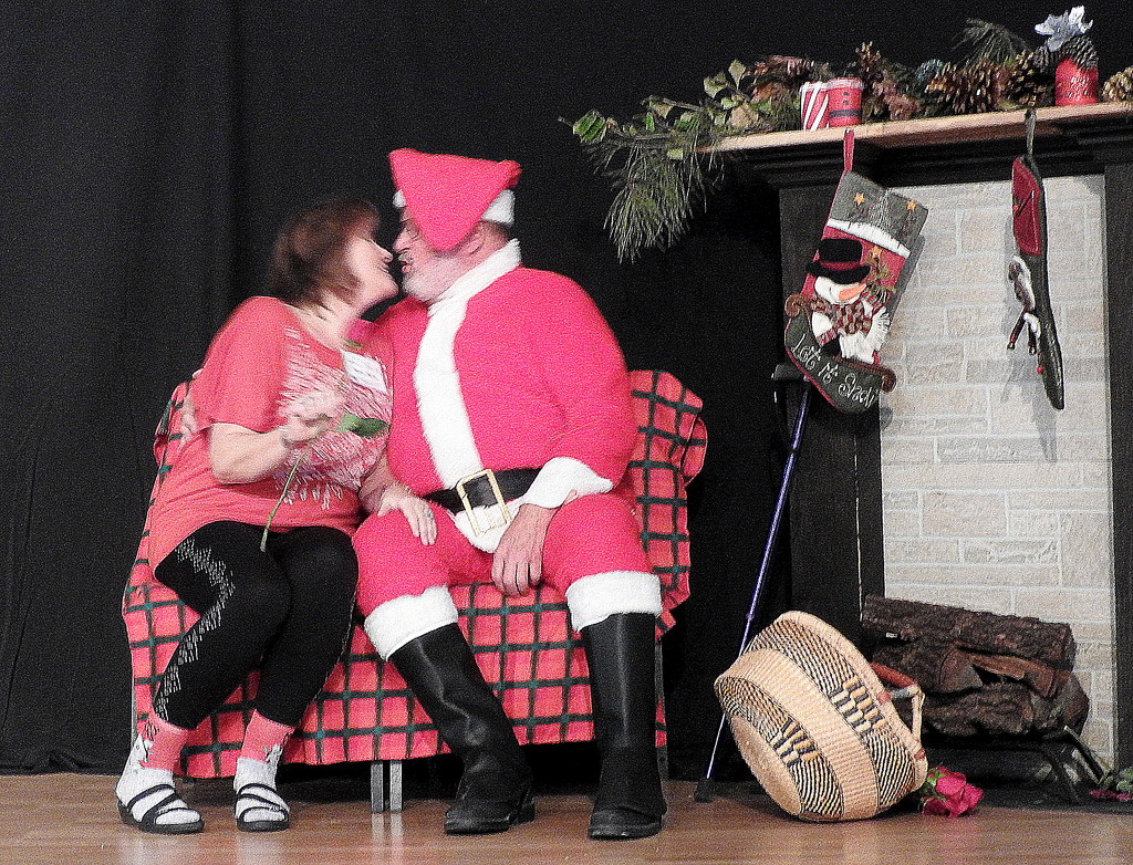 Mama kissing Santa Claus by homeschoolmom