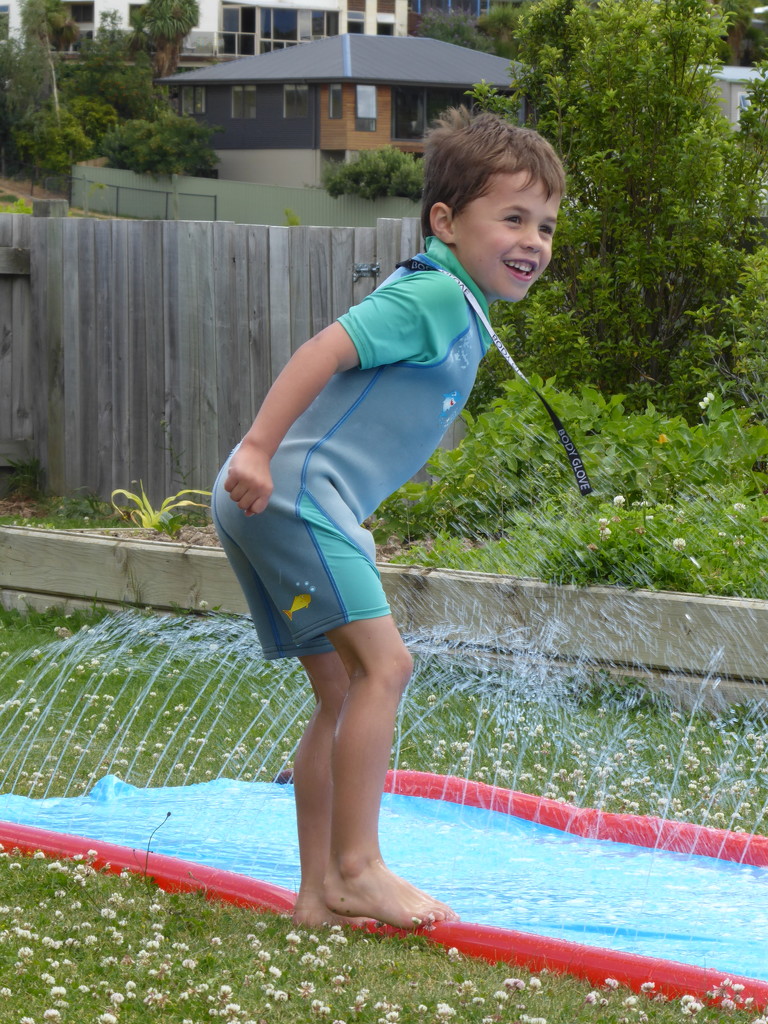 Barnaby with one of his Christmas presents- a water slide.  by chimfa