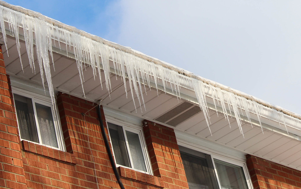 Icicles hanging from the roof by mittens