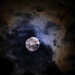 Full moon with clouds by dkbarnett