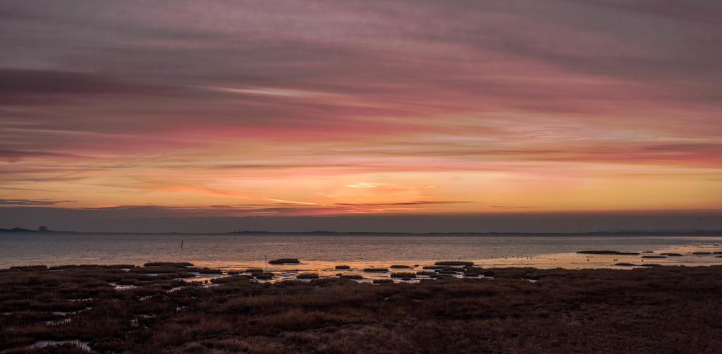 Sunrise over Lindisfarne Bay by inthecloud5