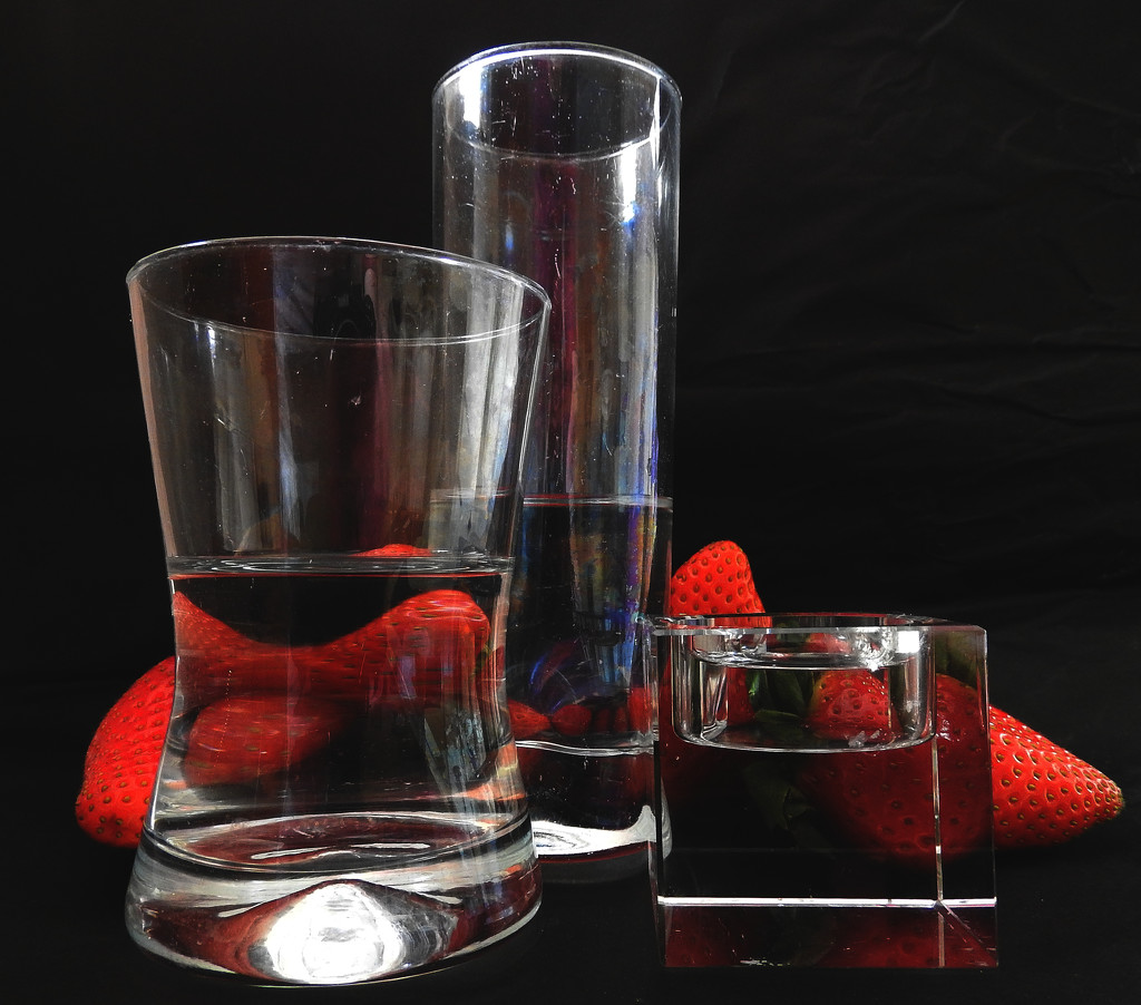 raspberries, glasses and water by marijbar