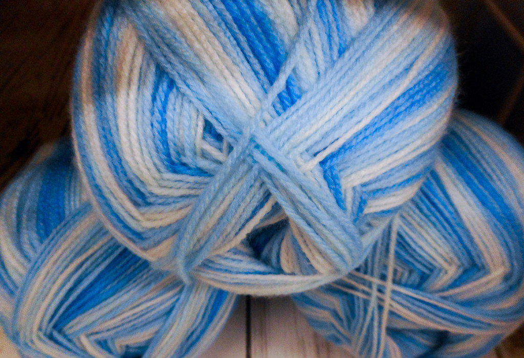 Blue yarn by mittens