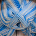 Blue yarn by mittens