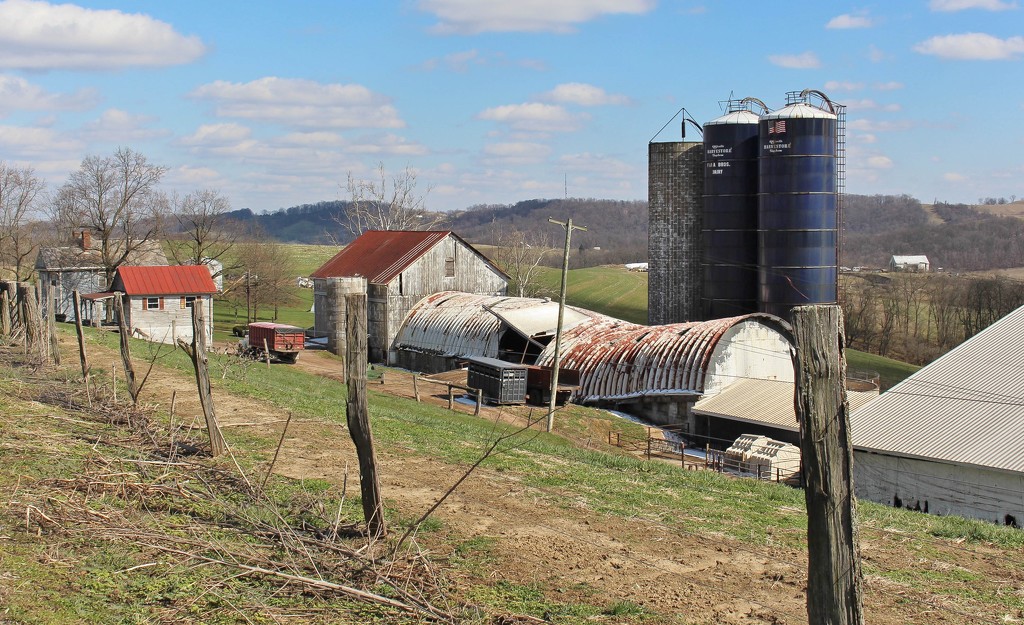 Farm buildings near the road by mittens