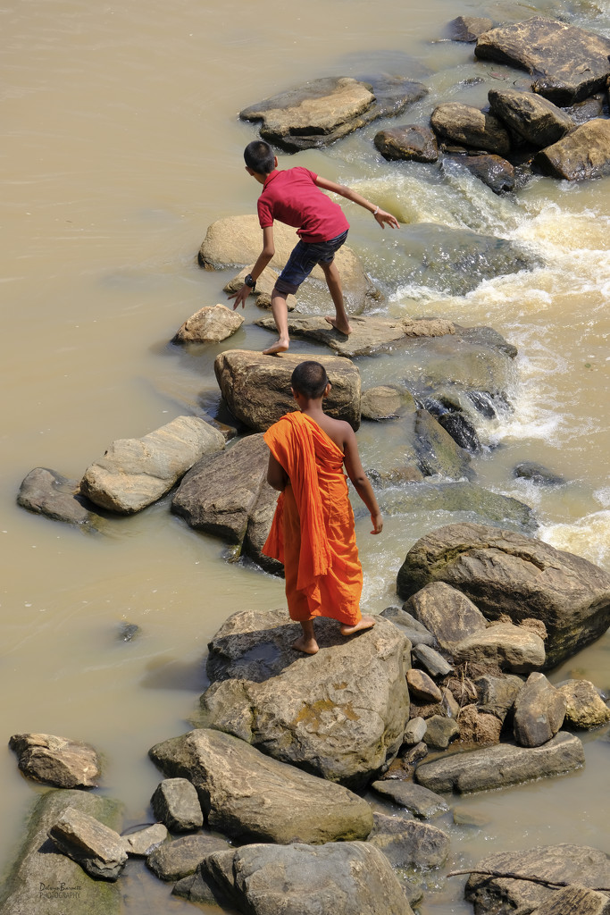 Two boys in the river by dkbarnett