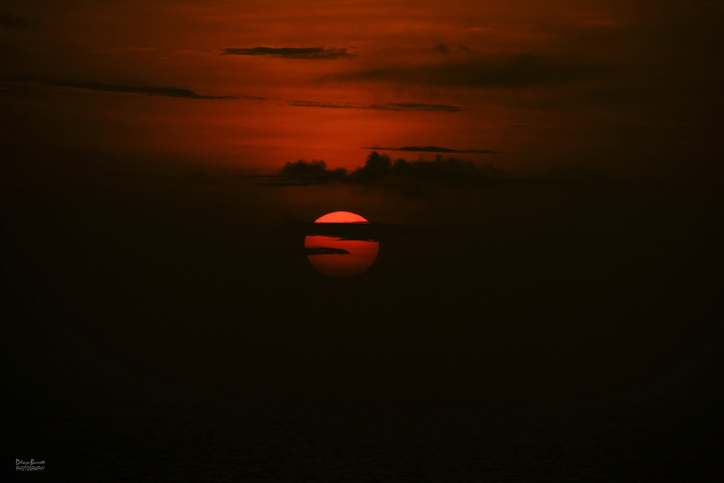 Sunset over the ocean by dkbarnett