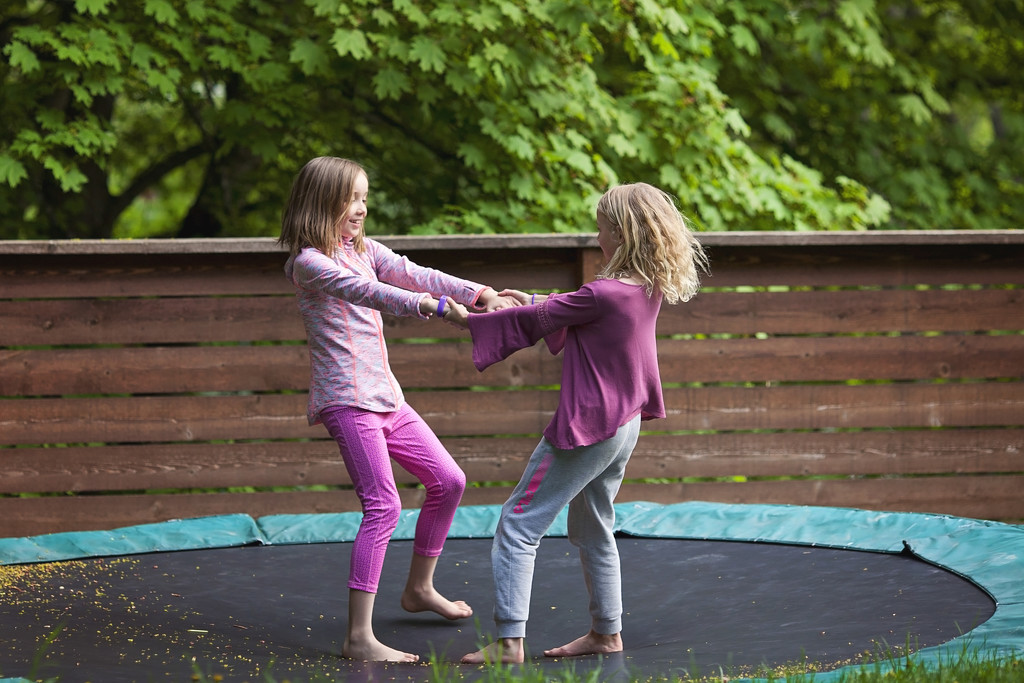 Girls on the trampoline by kiwichick