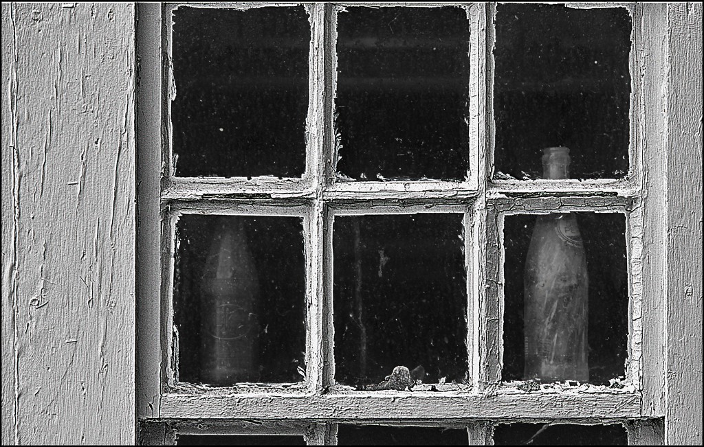 Glass Bottles in the Barn Window by olivetreeann