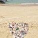 Home made heart on the beach.  by cocobella