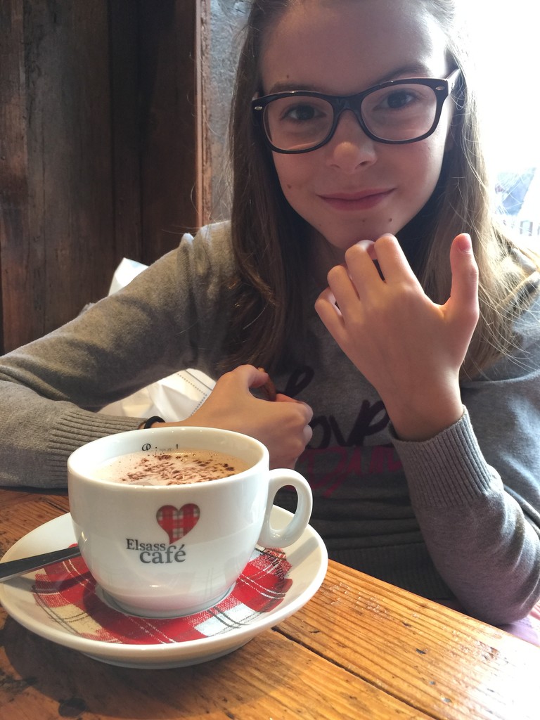 Young lady and a cup with a heart.  by cocobella