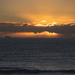 Sunset with cargo boat by dkbarnett