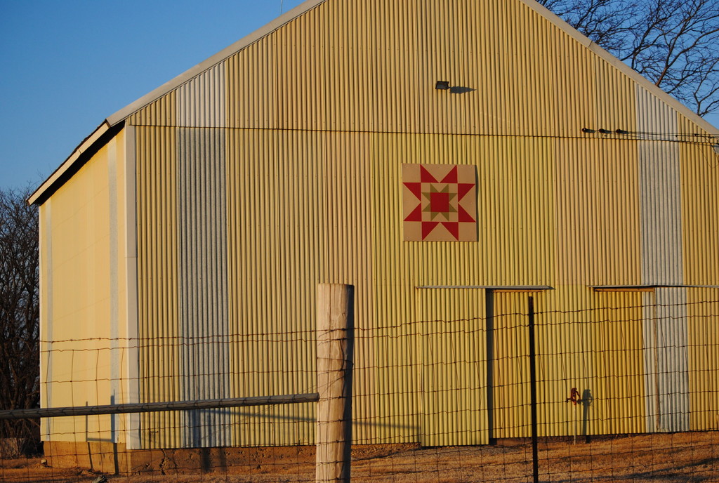 Barn Quilt on Yellow Tin Building by genealogygenie