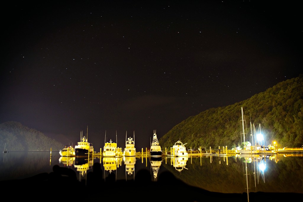 Boat harbour under a starry sky  by kiwinanna