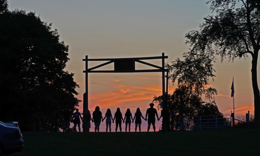 Seniors at the gate at sunset by rminer