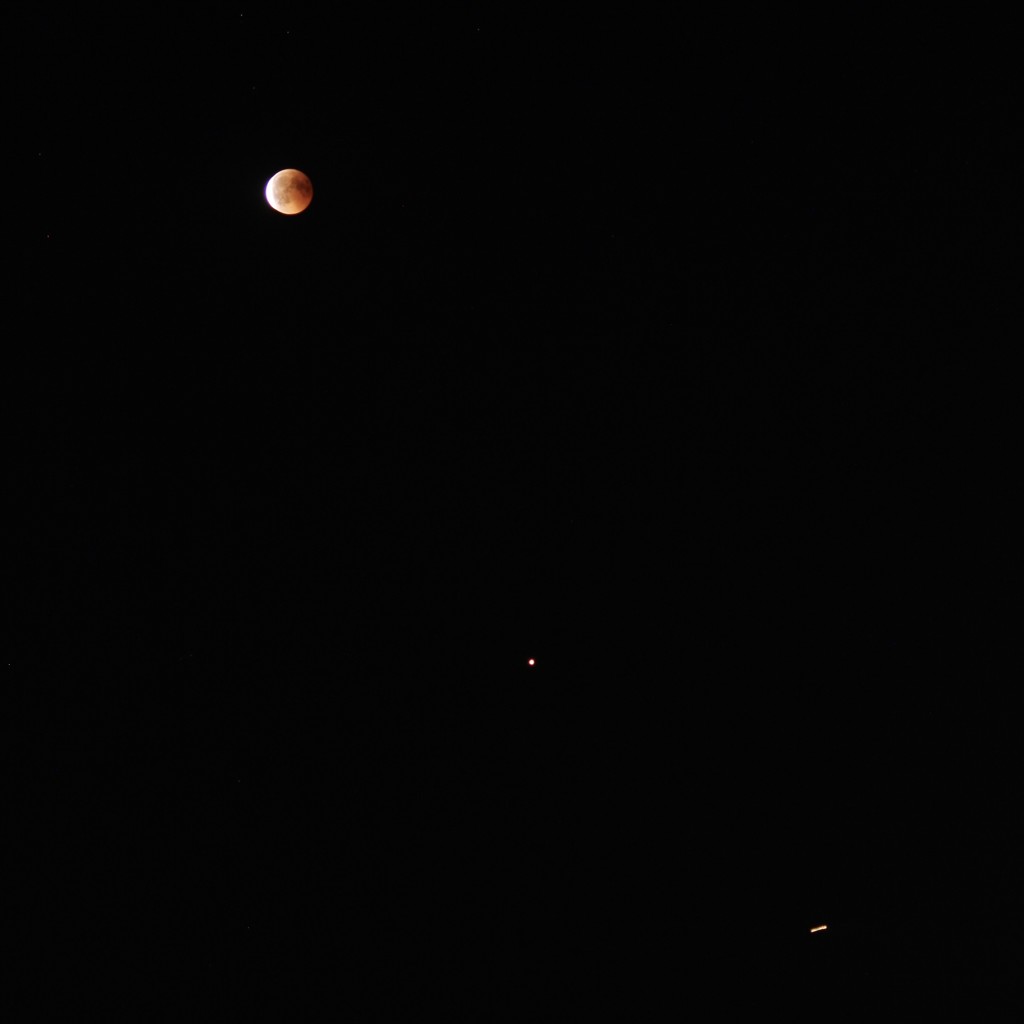 Red moon, Mars and a plane by vincent24