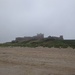 Bamburgh Castle in mist by clairemharvey