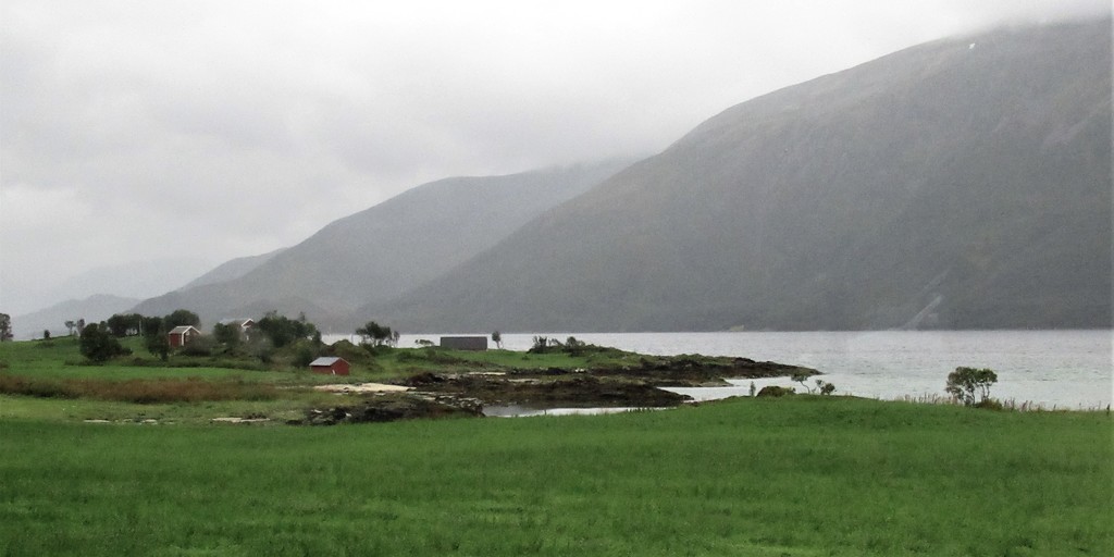 A typical homestead on the shores of a fjord. by robz