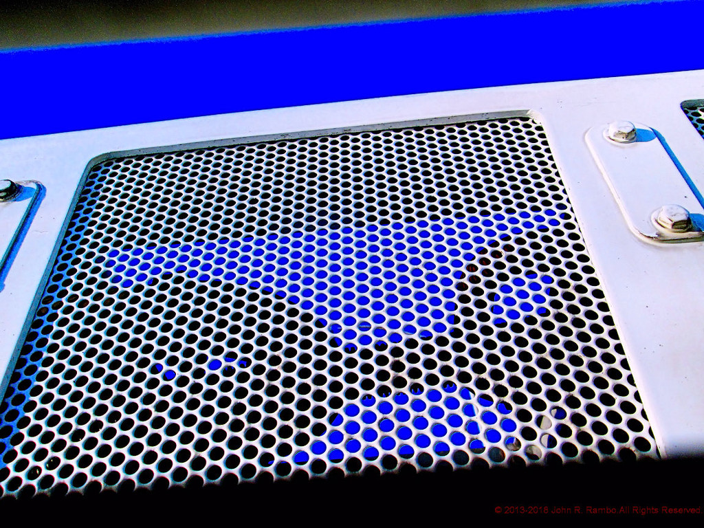 View of an Air Conditioning Unit from an Air Vent by jrambo001