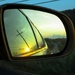 Side view mirror at sunset by mittens