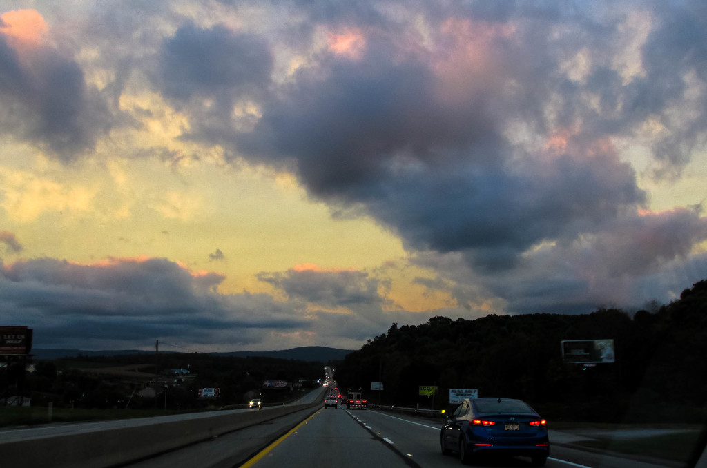 Pretty sky on the highway by mittens