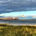 Container cargo ship entering Charleston Harbor. by congaree