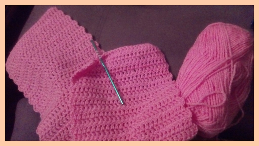A work in progress: a pink crocheted scarf. by grace55