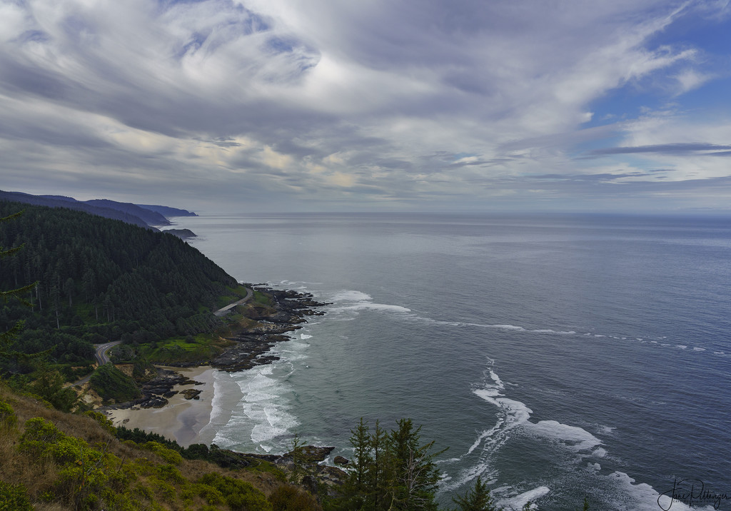 Clouds Tunneling Over the Coastline by jgpittenger