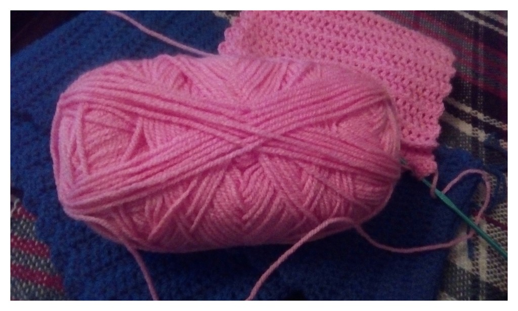 A crocheted pink scarf project. by grace55