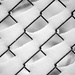 Chain link fence with snow drifts! by fayefaye