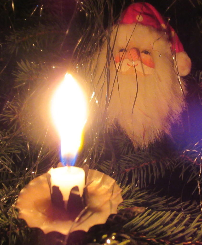 Santa is watching the candle flame by bruni