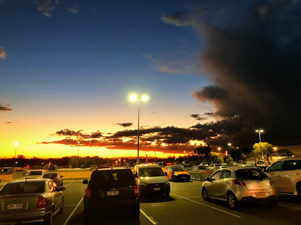 sunset in the shopping centre carpark  by corymbia