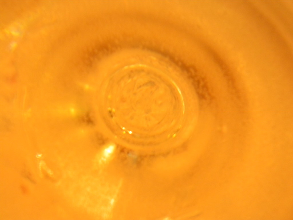 Bottom of Glass of Grape Juice by sfeldphotos