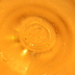 Bottom of Glass of Grape Juice by sfeldphotos