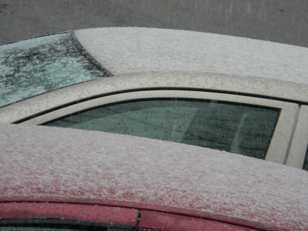 Snow on top of cars by sfeldphotos
