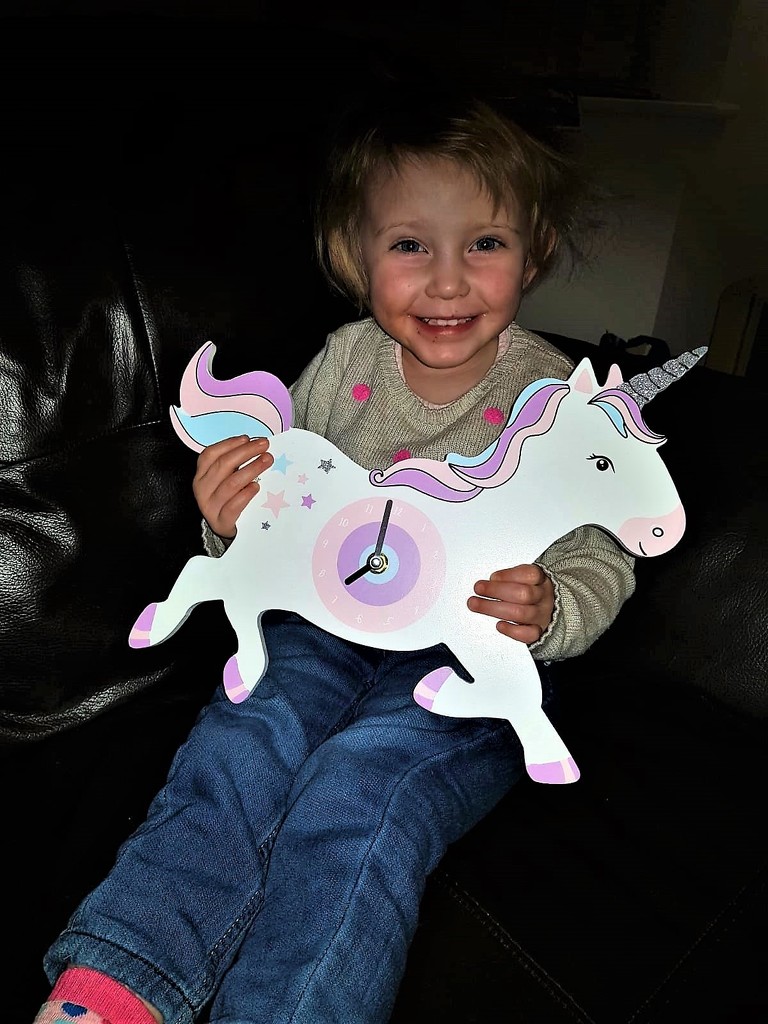 Niamh with her Unicorn Clock by susiemc