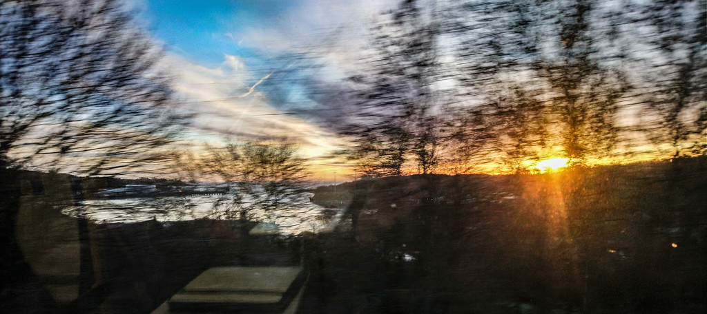 Sunrise from the train by frequentframes
