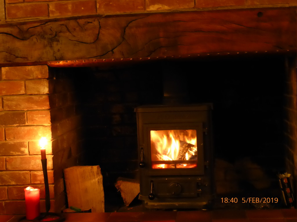 A nice fire to sit by on a cold day by snowy