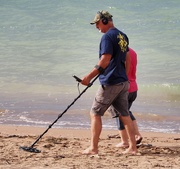 20th Mar 2019 - These folks walked the length of beach with their metal detector , we watched for quite a while seeing them pick up ? putting it in their goodie bag