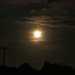 Tonights rising moon , I liked the way light caught on clouds and on the power pole by Dawn