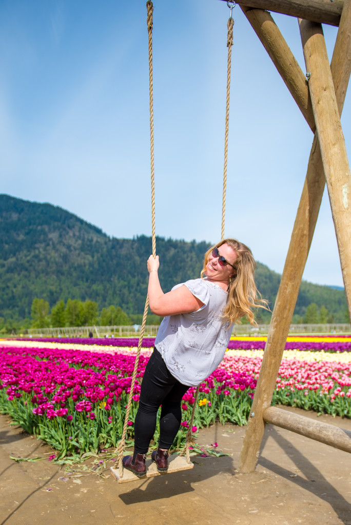 Sarah swinging in the Tulip Field by kwind