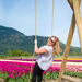 Sarah swinging in the Tulip Field by kwind