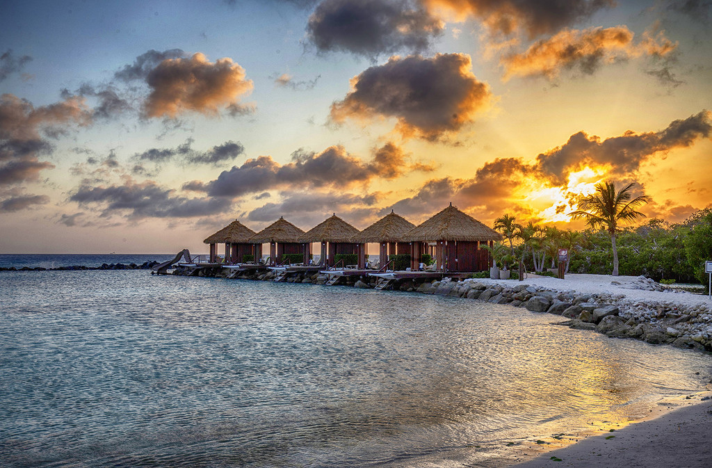 Sunset Huts on Flamingo Beach by pdulis