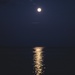 Full moon over the ocean by nicolecampbell