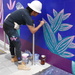 Woman muralist at working in Midtown Atlanta by swagman